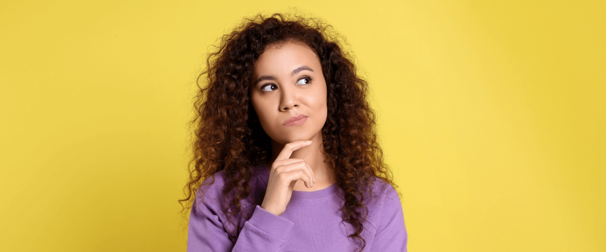 Woman standing and pondering