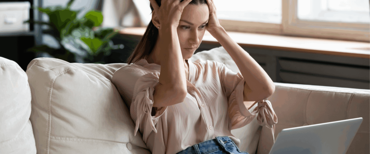A woman researching how to improve her 618 credit score.