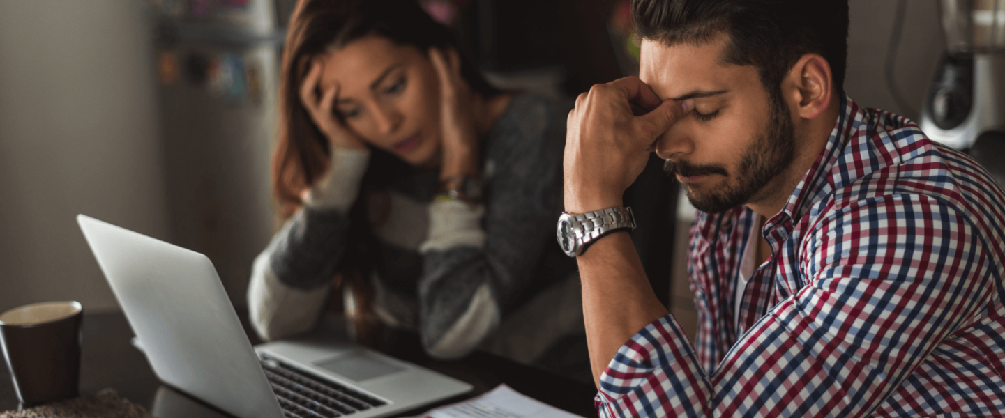 two people looking at a computer