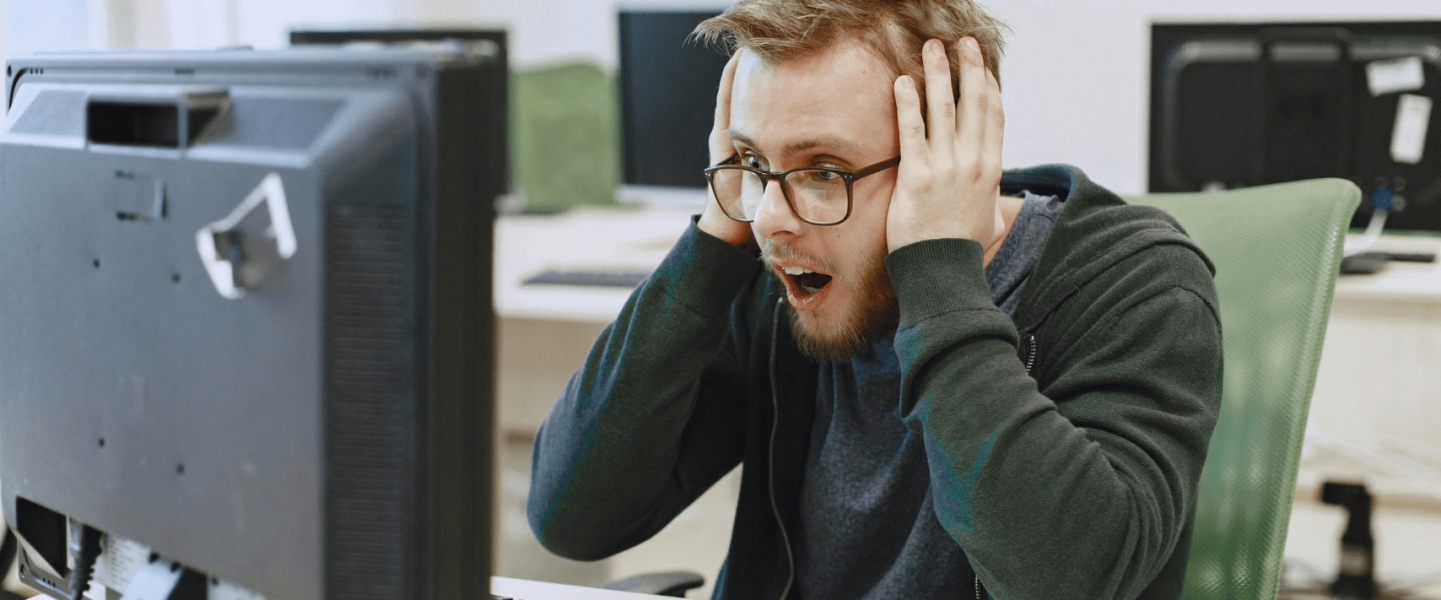 A man realizing his credit score dropped 300 points.