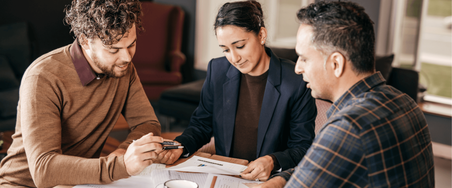 A couple looking through their documents to seek mortgage approval.