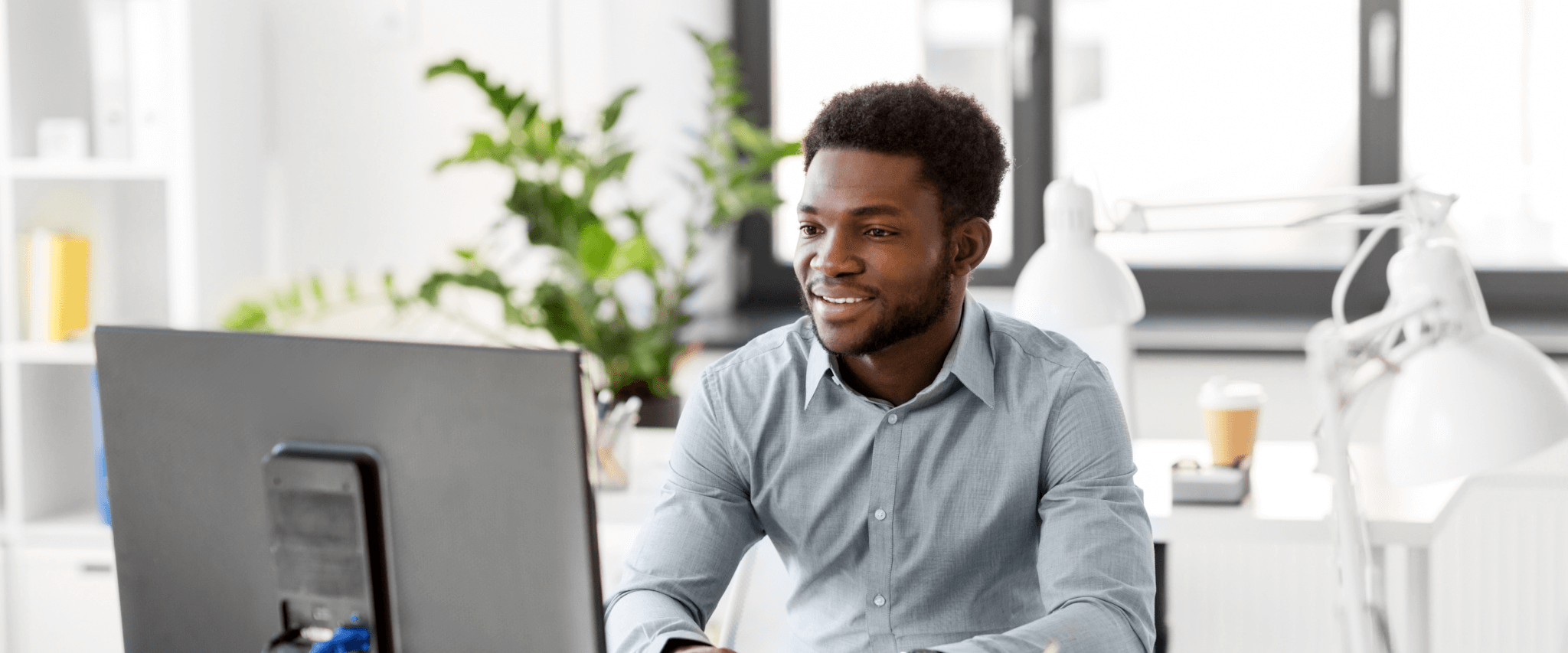 Black man using the computer.