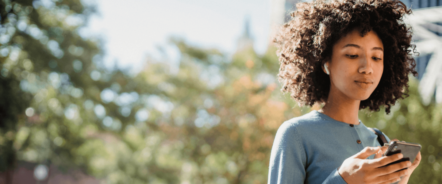 A woman researching what her 781 credit score means and how to get a an 800.