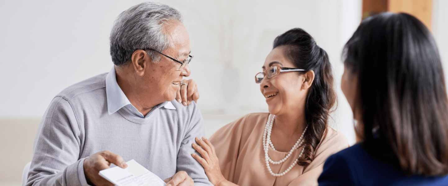 Older couple speaking with an advisor.