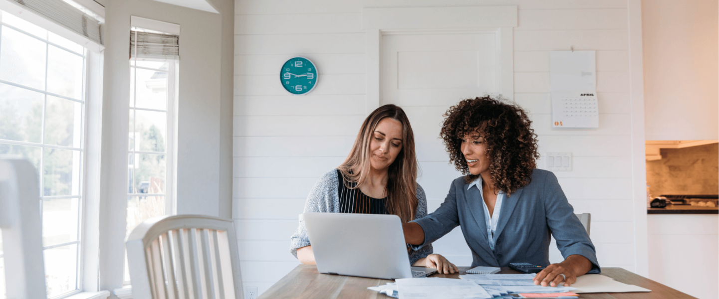 A woman and her financial advisor looking over finances.