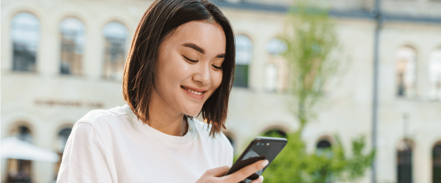 Happy woman on her phone.