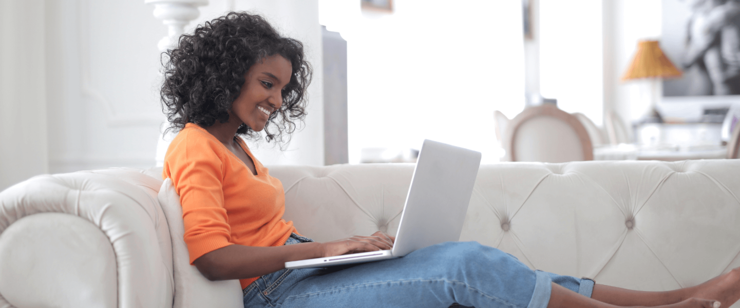 A woman researching what a 687 credit score means and how to make it better.