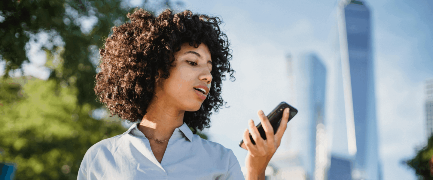 A woman looking up what a 654 credit score means.