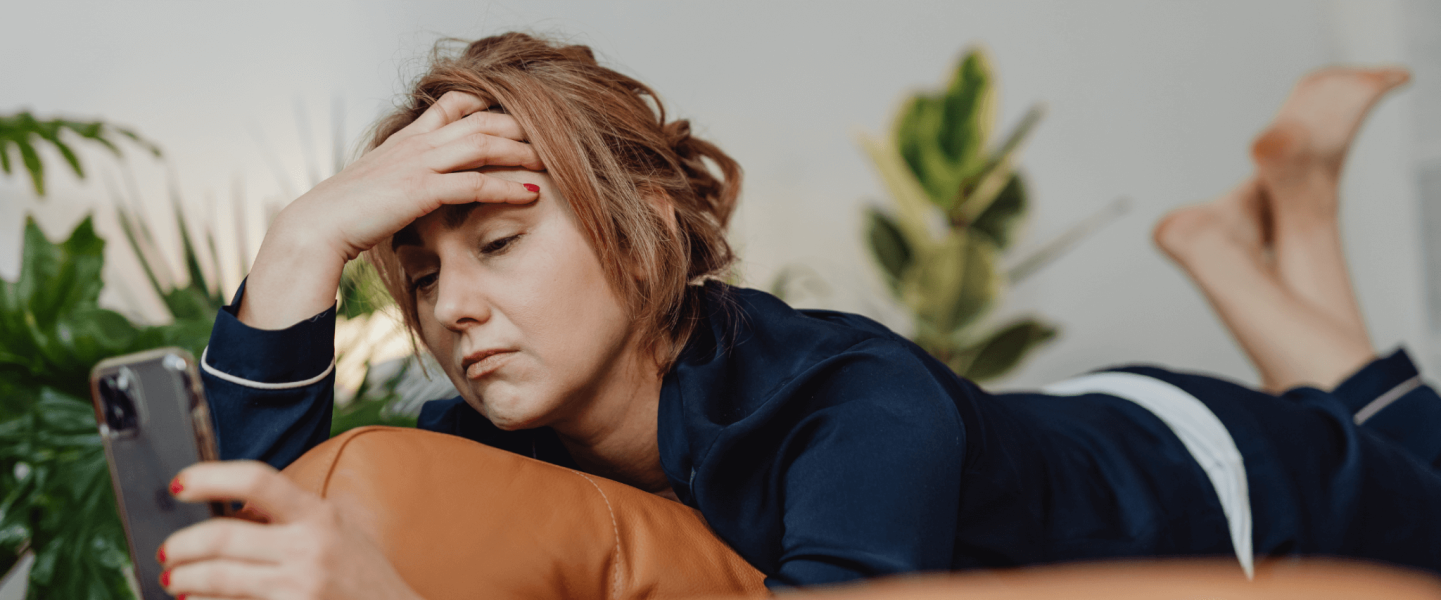 A woman checking her 596 credit score.