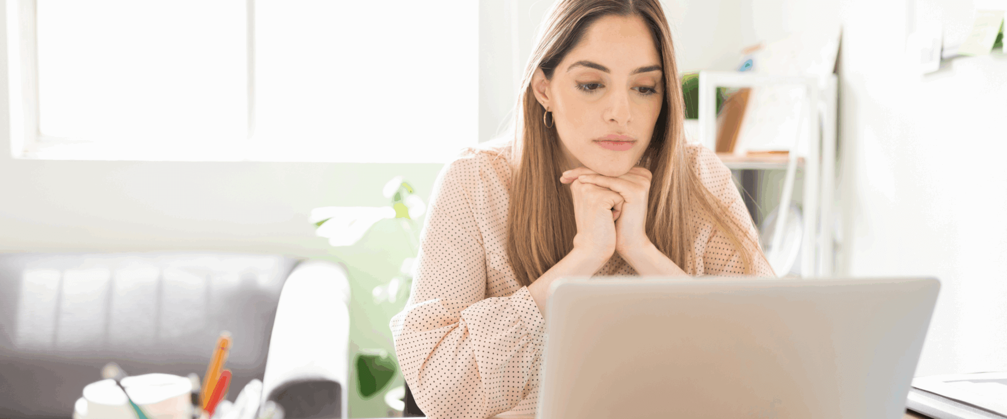 A woman researching how to improve her 530 credit score.