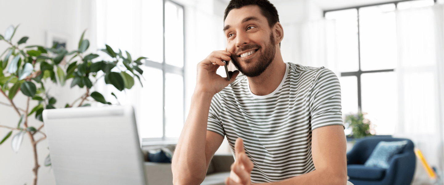 A man smiling and learning about his 802 credit score.