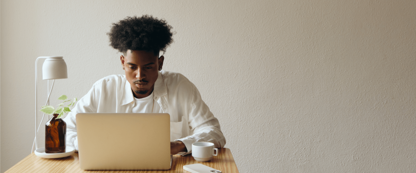 A man researching why his score dropped 100 points after opening a new credit card.