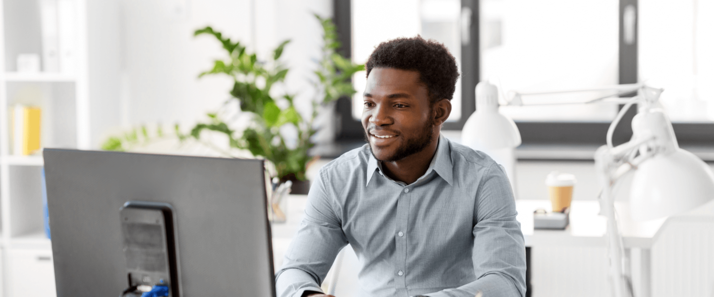 Black man using the computer.