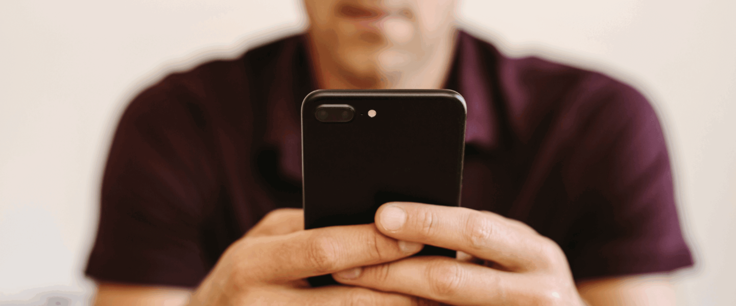 A man looking up what a 635 credit score means.