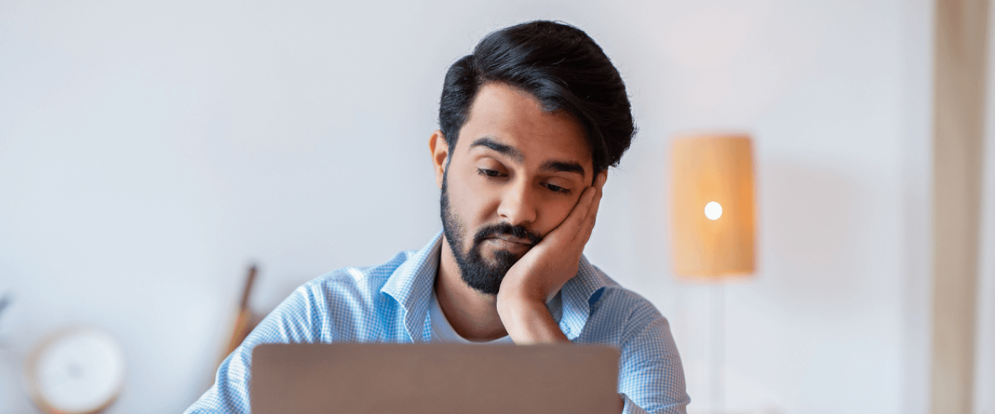 A man trying to learn how to improve his 500 credit score.