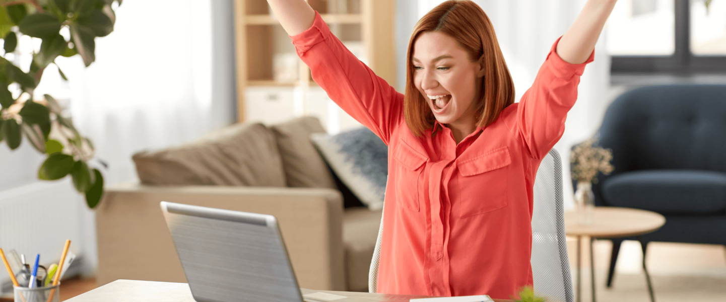 Happy woman on her laptop.