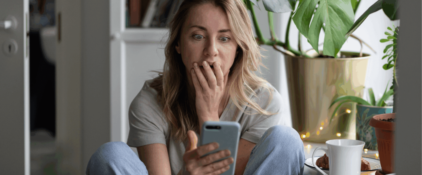 A woman looking up a 400 credit score.