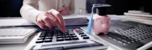A woman calculating her student loan payments