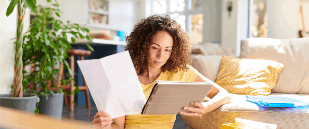 A woman researching how to get a 700 credit score in 90 days